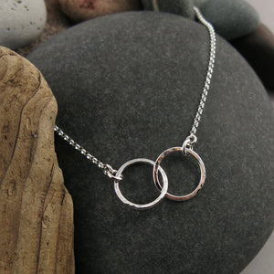 Embrace necklace by Mikel Grant Jewellery. Interlocking hammer textured silver circles.