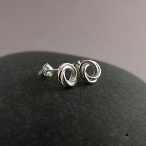 Silver love knot trinity stud earrings by Mikel Grant Jewellery. Artisan made trio knot studs.