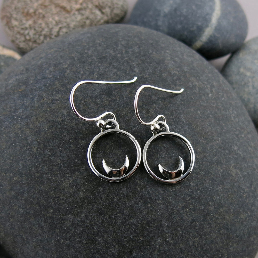 Mini silver crescent moon dream earrings by Mikel Grant Jewellery.