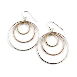 Mixed metal nesting trio circle earrings by Mikel Grant Jewellery. Artisan made hammer textured dangle earrings in silver and gold.