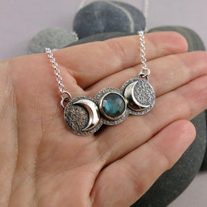 Handcrafted moon phase necklace with rose cut labradorite in oxidized sterling silver with crescent moons by Mikel Grant Jewellery.