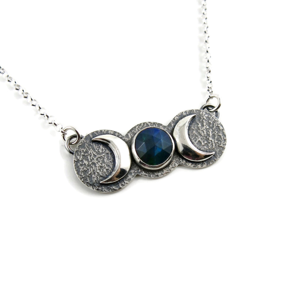 Handcrafted moon phase necklace with rose cut black opal in oxidized sterling silver with crescent moons by Mikel Grant Jewellery.