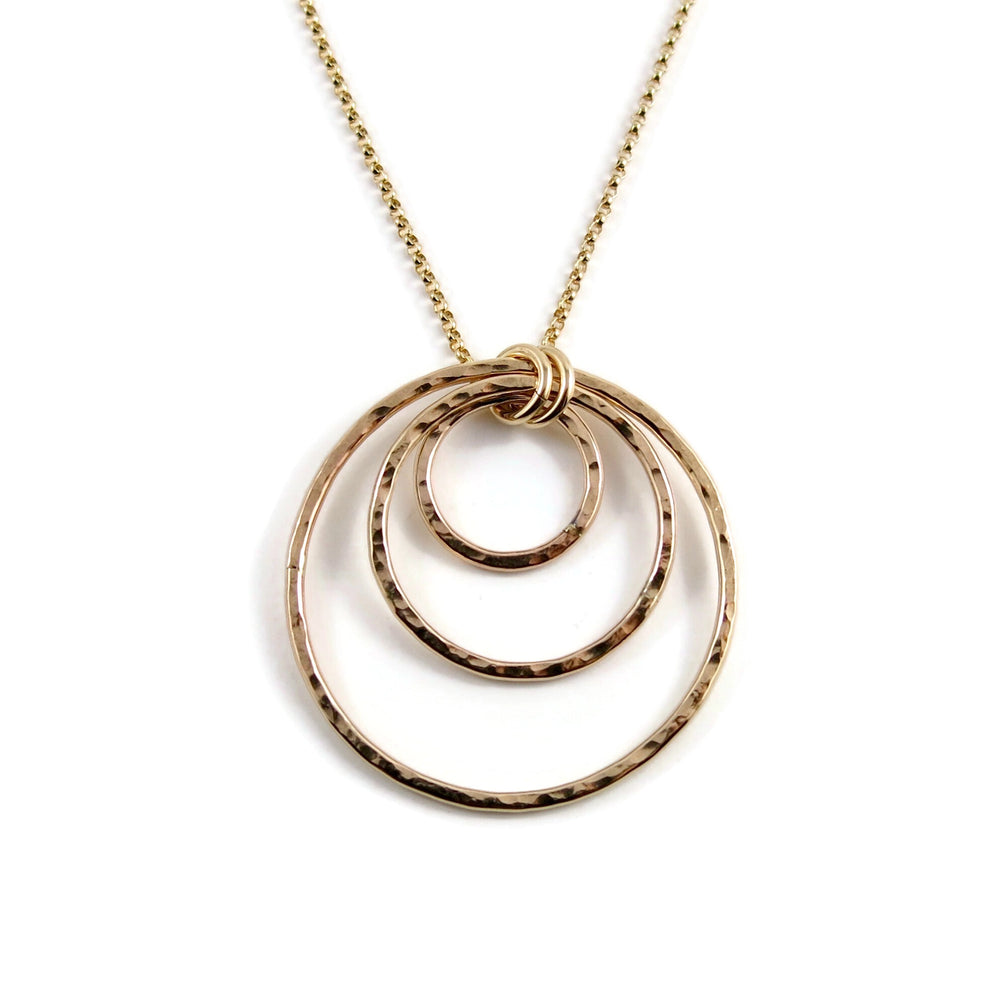 Nesting circles trio necklace in 14K gold fill by Mikel Grant Jewellery. Hammer textured open circles necklace.