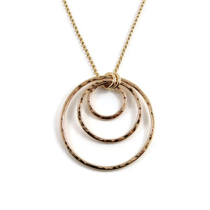Nesting circles trio necklace in 14K gold fill by Mikel Grant Jewellery. Hammer textured open circles necklace.
