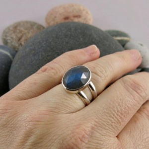 Artisan made rose cut labradorite ring in double banded sterling silver by Mikel Grant Jewellery.  Displayed on a hand.