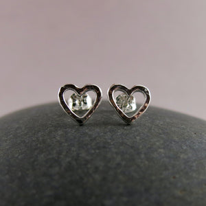 Open heart stud earrings by Mikel Grant Jewellery. Artisan made hammer textured silver everyday studs.