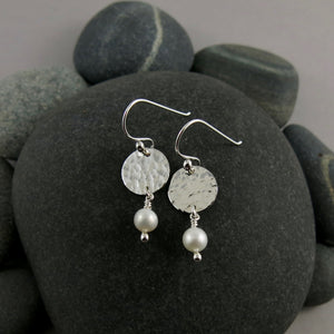 Pearl moondrop earrings by Mikel Grant Jewellery.  White freshwater pearls dangle from hand textured sterling silver discs.