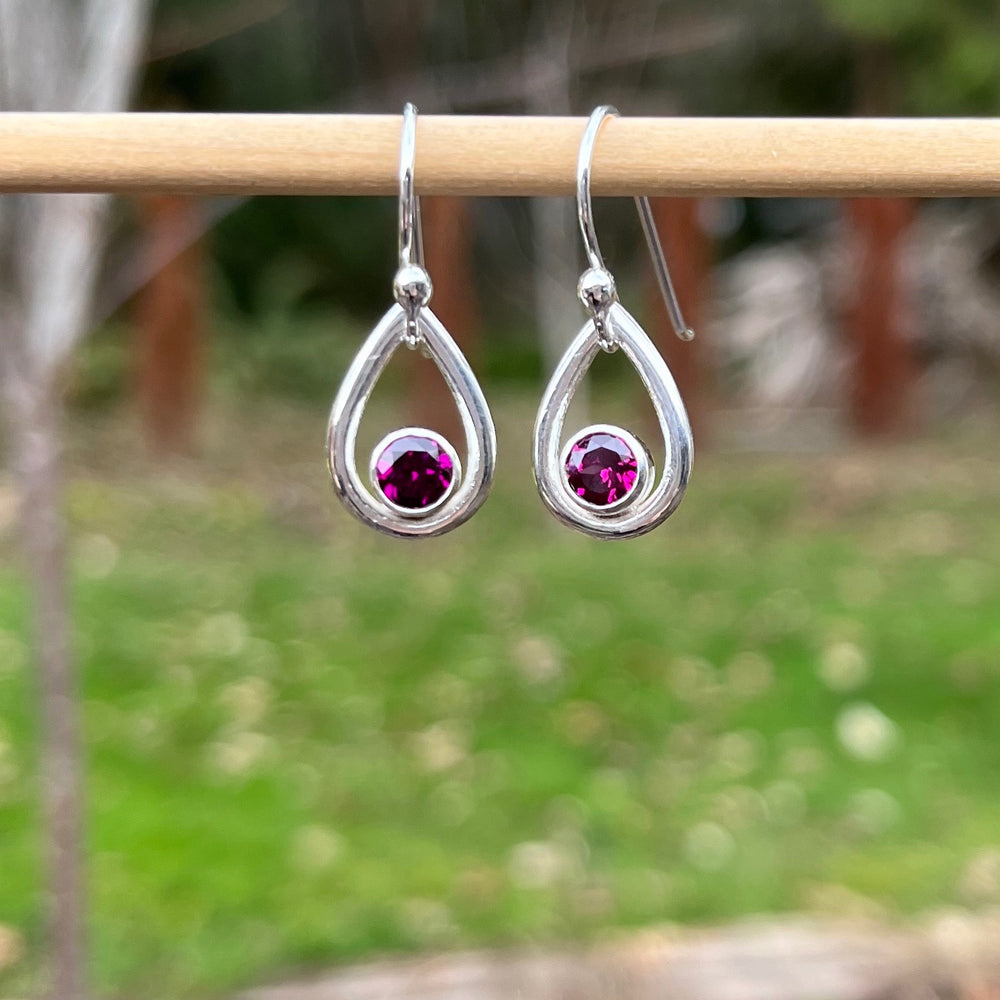 Rhodolite garnet raindrop earrings in sterling silver by Mikel Grant Jewellery.  Viva Magenta Jewellery Collection.