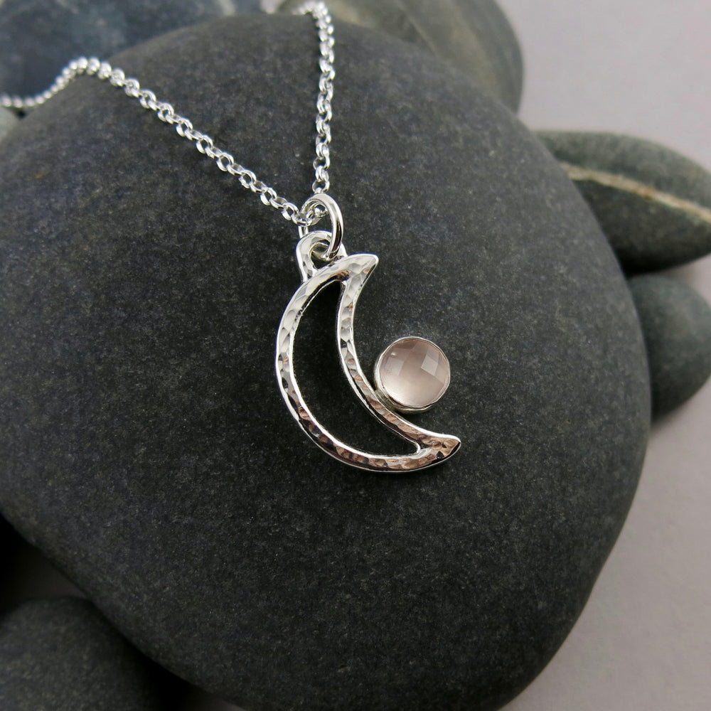 Handcrafted sterling silver crescent moon necklace with rose quartz by Mikel Grant Jewellery.