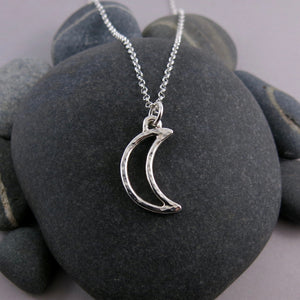 Handcrafted sterling silver crescent moon necklace by Mikel Grant Jewellery.