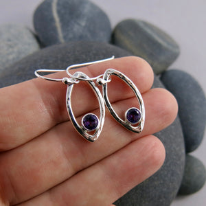 Minimalist sterling silver leaf earrings with faceted amethyst gemstones by Mikel Grant Jewellery.