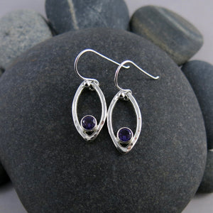 Minimalist sterling silver leaf earrings with faceted amethyst gemstones by Mikel Grant Jewellery.