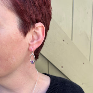 Minimalist sterling silver leaf earrings with faceted amethyst gemstones by Mikel Grant Jewellery.