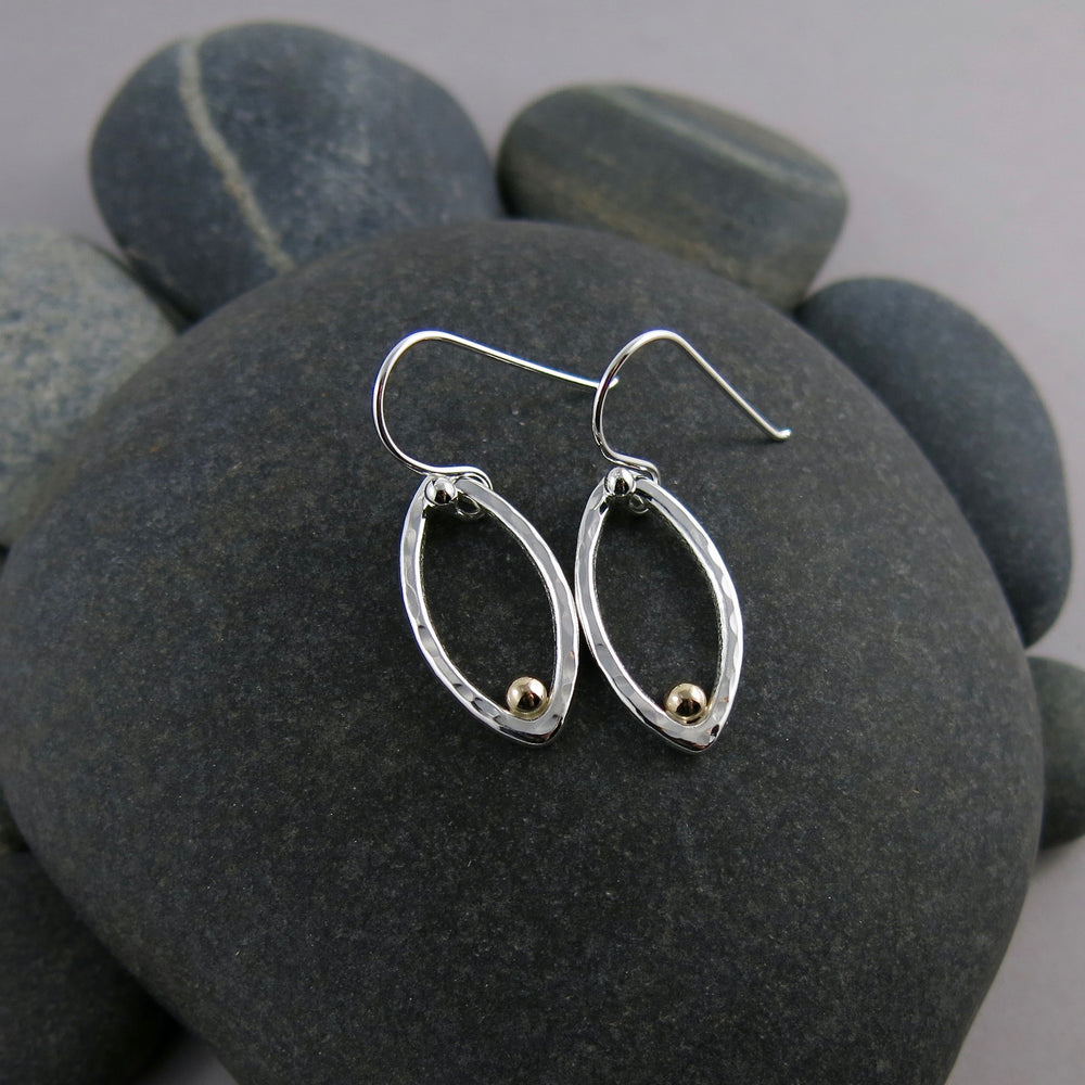 Modern minimalist sterling silver leaf earrings with gold dewdrops by Mikel Grant Jewellery.