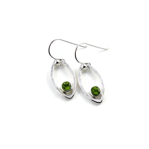 Minimalist sterling silver leaf earrings with faceted peridot gemstones by Mikel Grant Jewellery.