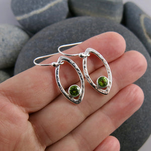 Minimalist sterling silver leaf earrings with faceted peridot gemstones by Mikel Grant Jewellery.