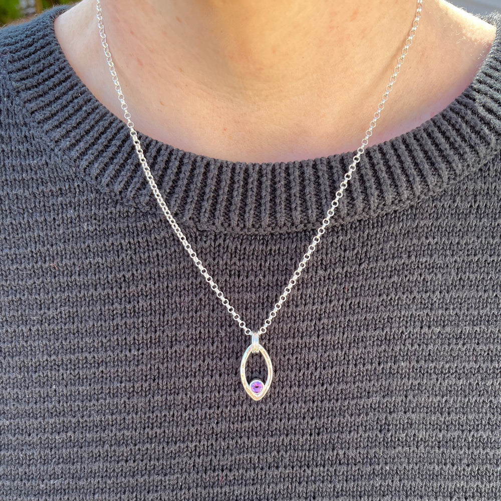 Modern minimalist sterling silver leaf necklace with faceted amethyst by Mikel Grant Jewellery.