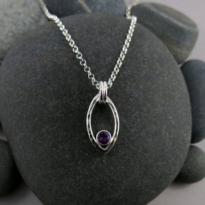 Modern minimalist sterling silver leaf necklace with faceted amethyst by Mikel Grant Jewellery.