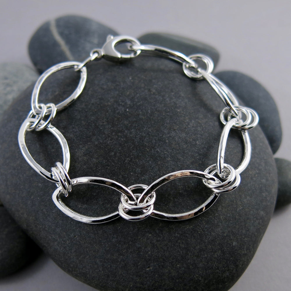 Modern minimalist silver leaves bracelet by Mikel Grant Jewellery.