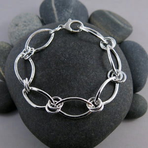 Modern minimalist silver leaves bracelet by Mikel Grant Jewellery.