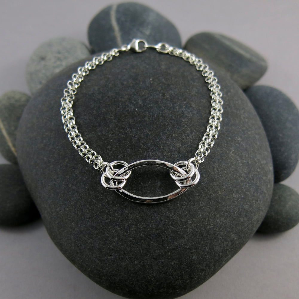 Modern minimalist silver leaf bracelet by Mikel Grant Jewellery.