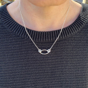 Modern minimalist sterling silver sideways leaf necklace by Mikel Grant Jewellery.