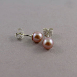 Simple pink pearl studs in sterling silver by Mikel Grant Jewellery.