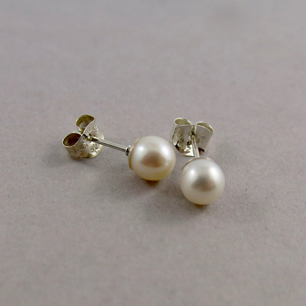 Simple white pearl studs in sterling silver by Mikel Grant Jewellery.