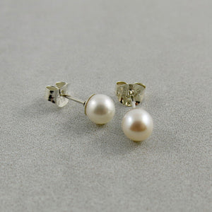 Simple white pearl studs in sterling silver by Mikel Grant Jewellery.