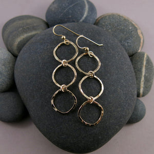 Gold open square trio drop earrings by Mikel Grant Jewellery. Artisan made hammer textured dangles.