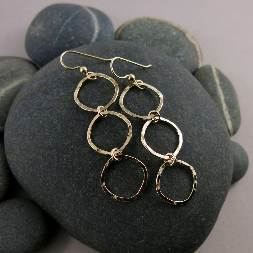 Gold open square trio drop earrings by Mikel Grant Jewellery.  Artisan made hammer textured dangles.