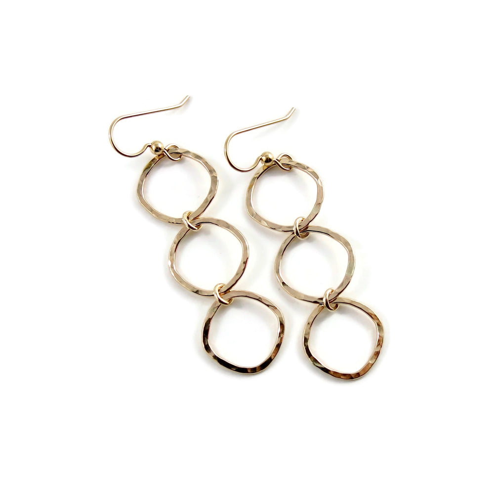 Gold open square trio drop earrings by Mikel Grant Jewellery. Artisan made hammer textured dangles.