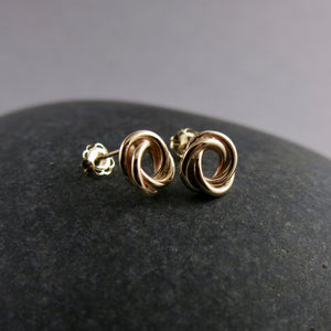 Gold love knot trio studs by Mikel Grant Jewellery.