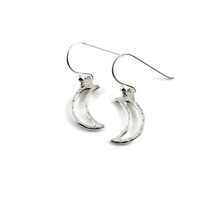 Handcrafted sterling silver hammer textured crescent moon dangle earrings by MIkel Grant Jewellery.