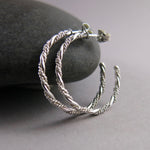 Sterling silver ornate twist open hoop stud earrings by Mikel Grant Jewellery.  Artisan made on the Sunshine Coast of BC.