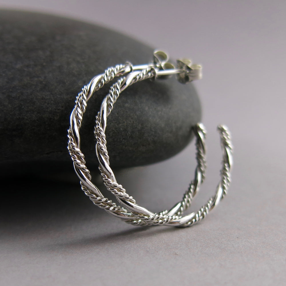 Sterling silver ornate twist open hoop stud earrings by Mikel Grant Jewellery. Artisan made on the Sunshine Coast of BC.