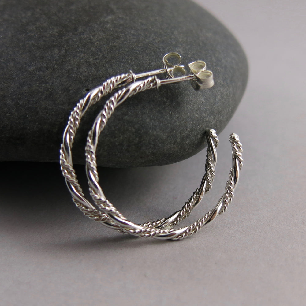 Sterling silver ornate twist open hoop stud earrings by Mikel Grant Jewellery. Artisan made on the Sunshine Coast of BC.