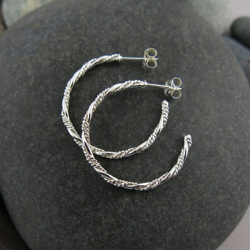 Sterling silver ornate twist open hoop stud earrings by Mikel Grant Jewellery. Artisan made on the Sunshine Coast of BC.