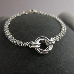 Silver love knot trio bracelet by Mikel Grant Jewellery.  Timeless love knot bracelet.