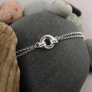 Silver love knot trio bracelet by Mikel Grant Jewellery. Timeless love knot bracelet.