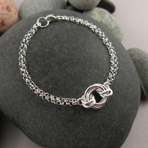 Silver love knot trio bracelet by Mikel Grant Jewellery. Timeless love knot bracelet.