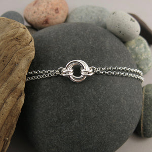 Silver love knot trio bracelet by Mikel Grant Jewellery. Timeless love knot bracelet.