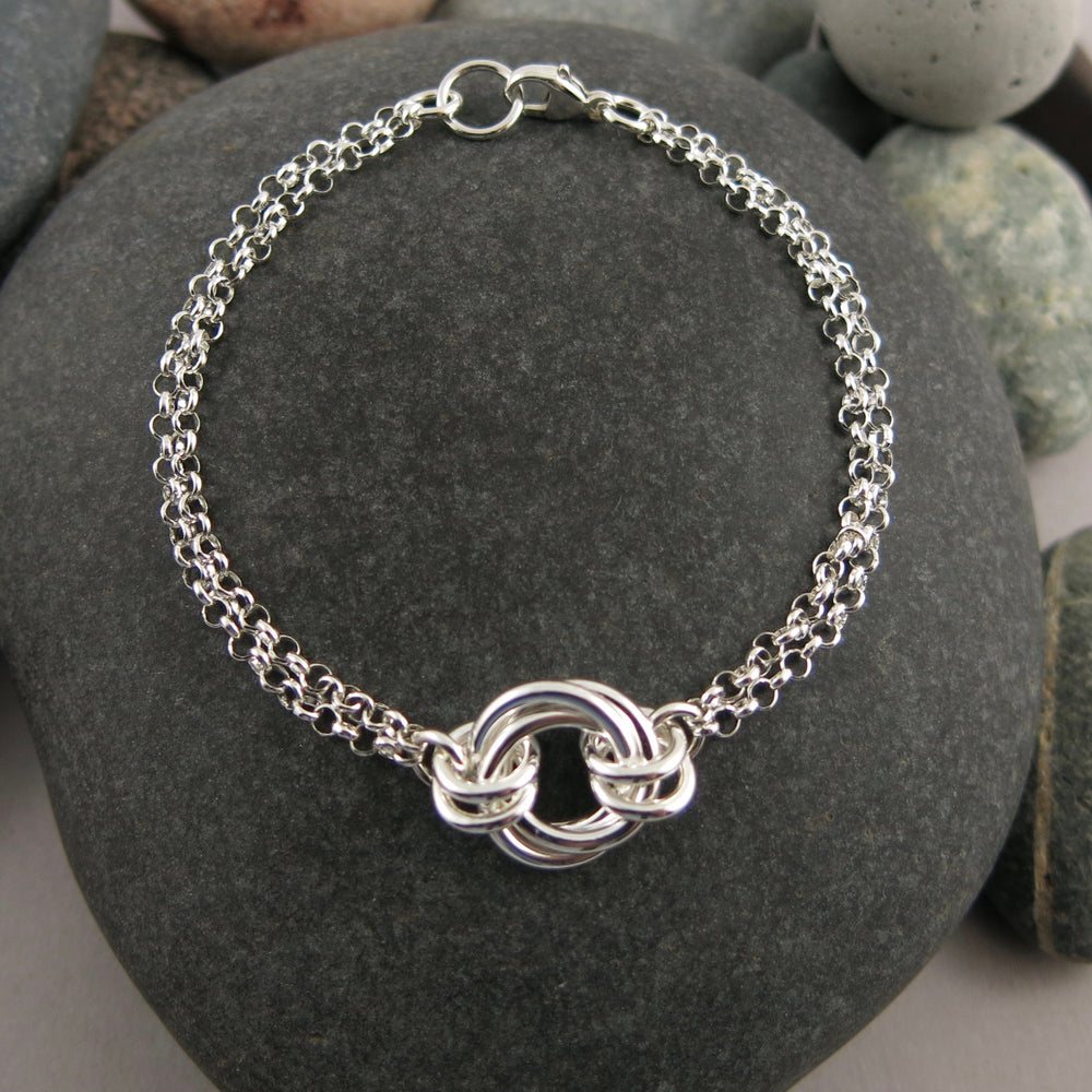 Silver love knot trio bracelet by Mikel Grant Jewellery. Timeless love knot bracelet.