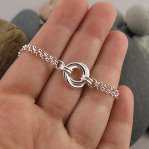 Silver love knot trio bracelet by Mikel Grant Jewellery. Timeless love knot bracelet.