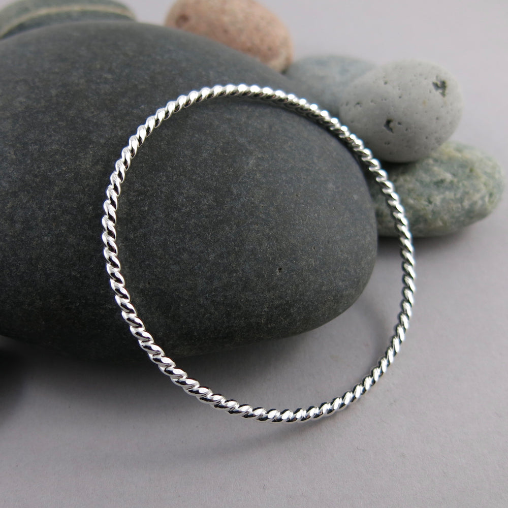 Artisan made thick sterling silver twist bangle by Mikel Grant Jewellery.