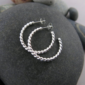 Twisted sterling silver open hoop studs by Mikel Grant Jewellery. Modern, comfortable, artisan made.