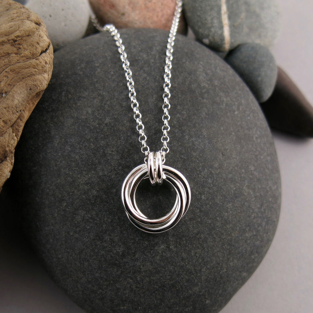 Silver love knot trio necklace by Mikel Grant Jewellery. Artisan made timeless love knot trio necklace.