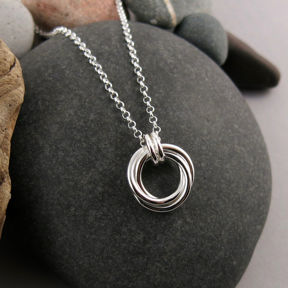 Silver love knot trio necklace by Mikel Grant Jewellery.  Artisan made timeless love knot trio necklace.