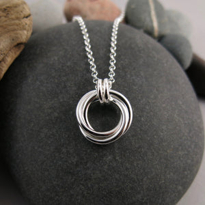 Silver love knot trio necklace by Mikel Grant Jewellery. Artisan made timeless love knot trio necklace.