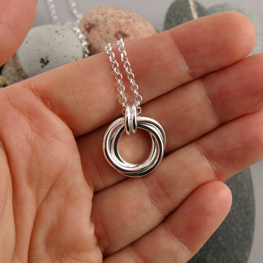 Silver love knot trio necklace by Mikel Grant Jewellery. Artisan made timeless love knot trio necklace.